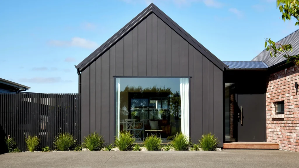Contemporary home finished with sleek cladding — learn more about us and how we deliver modern exterior solutions — by Cladding Wellington.