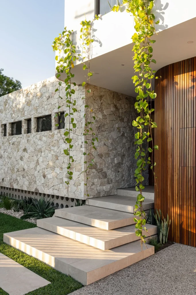 Sleek modern house featuring exterior cladding on walls, offering a stylish and durable exterior — by Cladding Wellington.