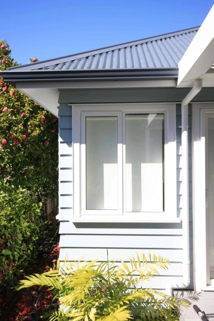House with completed recladding, showcasing a sleek and modern exterior finish — by Cladding Wellington.