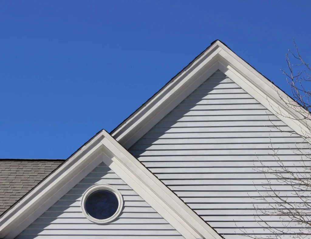 Recladding home featuring updated exterior materials for improved insulation and appearance — by Cladding Wellington.