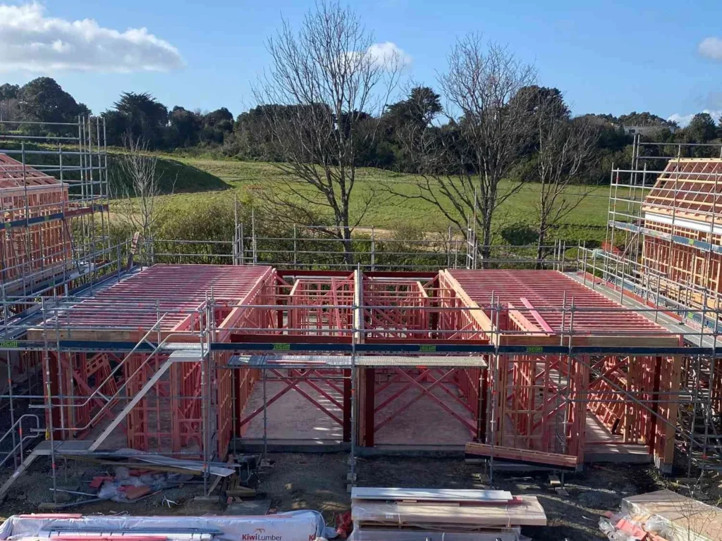 Residential property under construction with recladding underway, preparing for a modern exterior finish — by Cladding Wellington.