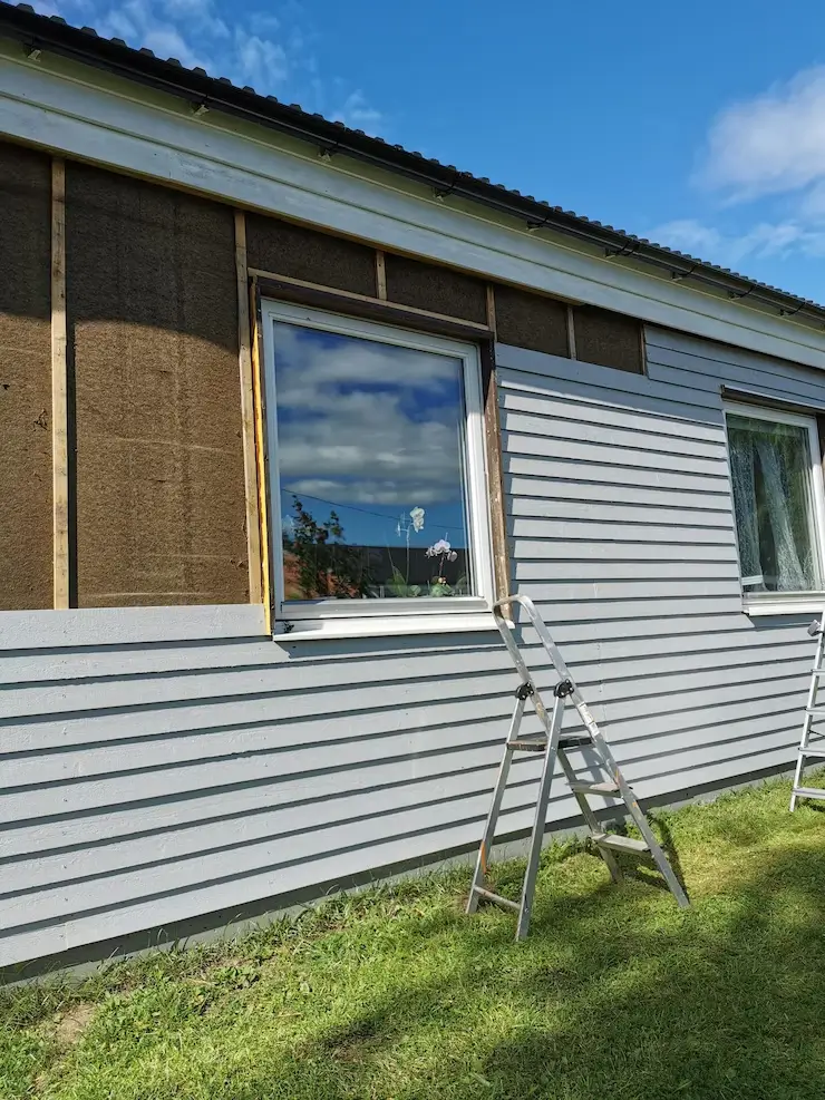 Exterior wall undergoing recladding, replacing old materials for a refreshed and durable finish — by Cladding Wellington