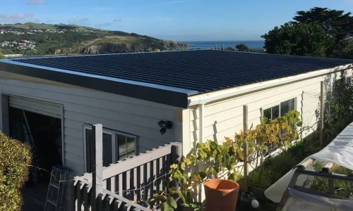 Modern house featuring newly installed exterior cladding for a sleek finish — by Cladding Wellington. Modern house featuring newly installed exterior cladding for a sleek finish — by Cladding Wellington.