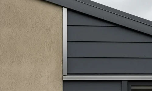 Modern recladding upgrade combining plaster and metal finishes completed by Cladding Porirua specialists.